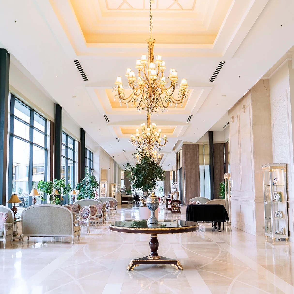 An empty hotel lobby with chairs and sofas